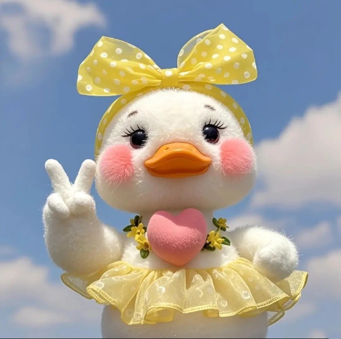 hình nền con vịt chibi đeo nơ vàng