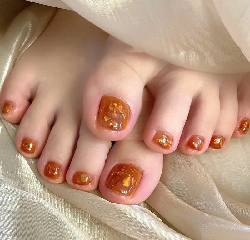 nail chân màu cam ẩn xà cừ